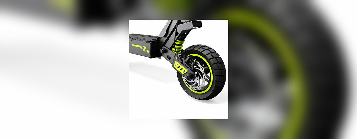 Close-up of the front wheel and tyre of a grey and green isinwheel electric scooter